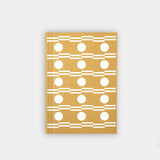 A limited edition A6 pocket layflat weekly planner with a gold-colored embossed cover featuring a geometric pattern of circles and stripes.