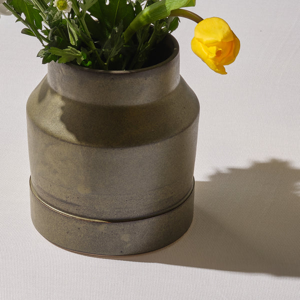 Small green stepped vase